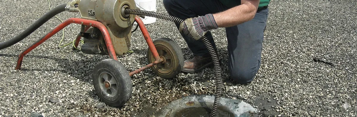 sewer rodding technician actively removing blockages from a sewer line in Lakeland, FL