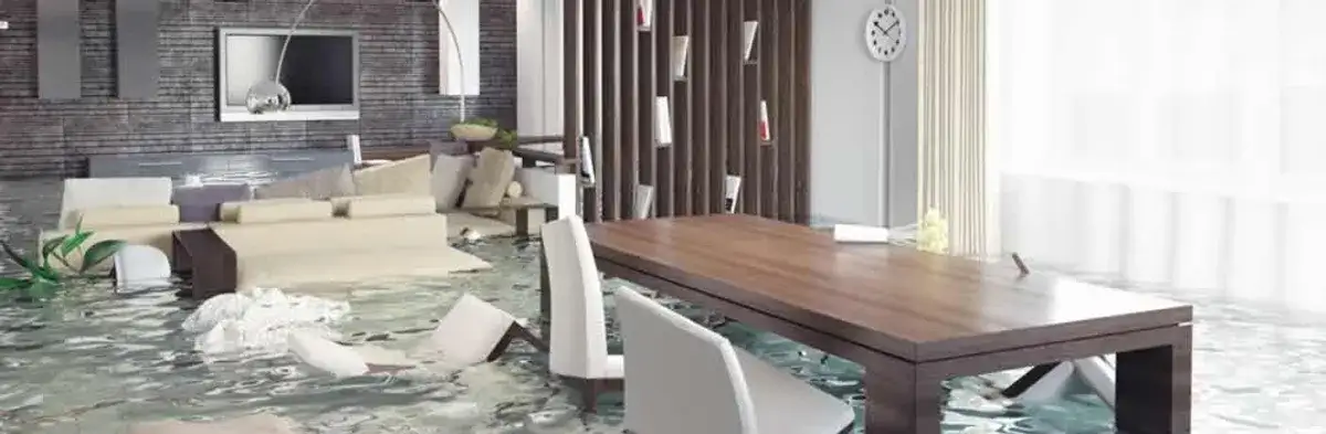 home interior affected by water damage with flooded floors and displaced furniture in Lakeland, FL